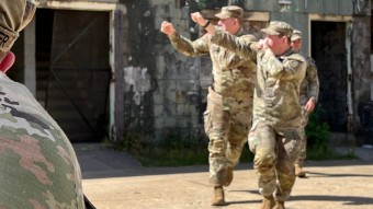 Soldiers walking from building