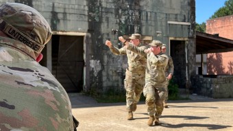 Soldiers walking from building