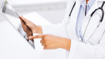 Doctor with tablet