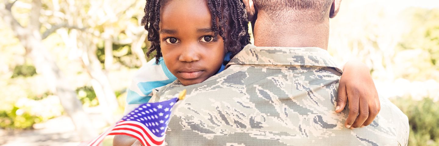 Daughter with flag held by father