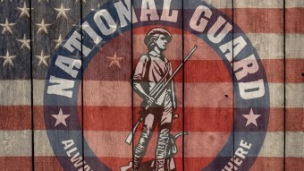National Guard logo on top of flag