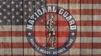 National Guard logo on top of flag