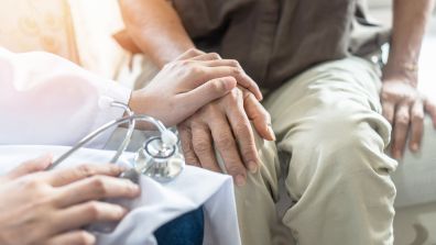 Doctor and patient closeup on hands